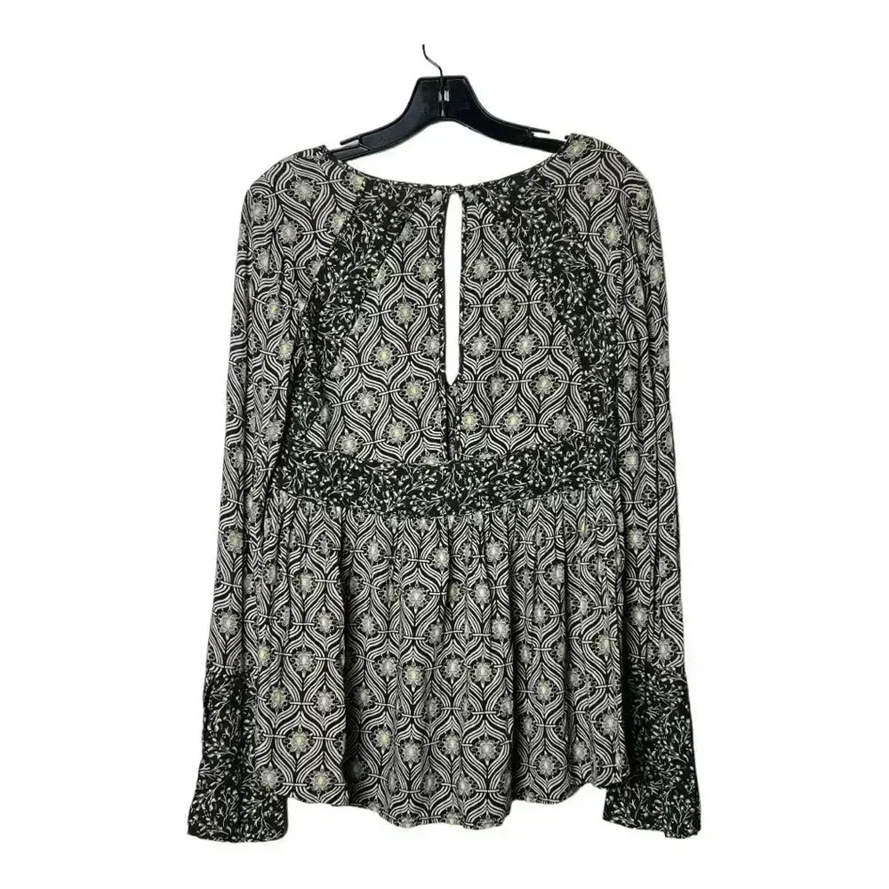 1514. FREE‎ PEOPLE ROLLING HILLS FLARED SLEEVE TOP SIZE XSMALL FLORAL PATTERN
